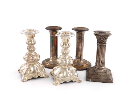 A mixed lot of silver candlesticks, comprising: an Edwardian pair, Birmingham 1904, circular form, plain columns, height 11.3