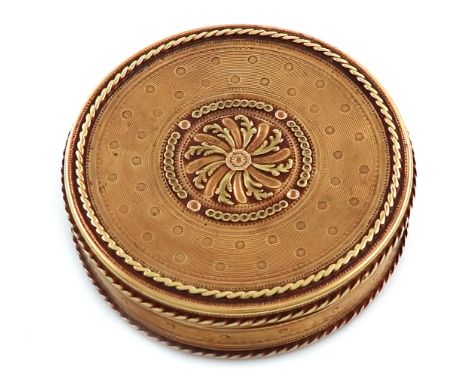 An 18th century French gold snuff box, Paris 1783-89, maker's mark partially worn, circular form, the centre with a two-colou