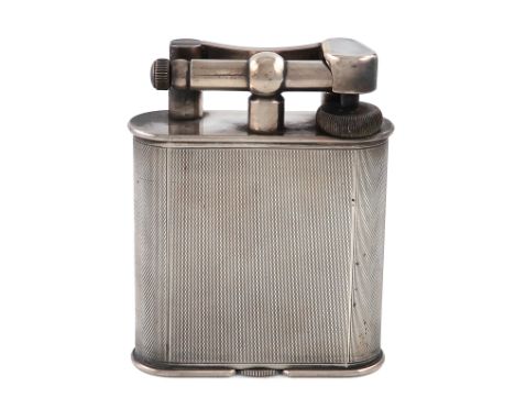 By Dunhill, a large electroplated table lighter, design number 737418, upright rounded rectangular form, engine-turned decora