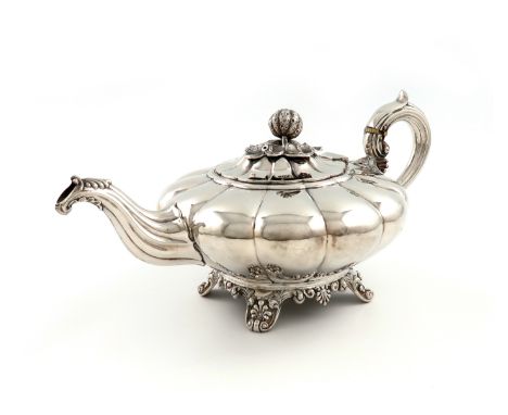 λA William IV Irish silver teapot, by James Fray, Dublin 1837, lobed circular form, scroll handle with ivory insulators, the 