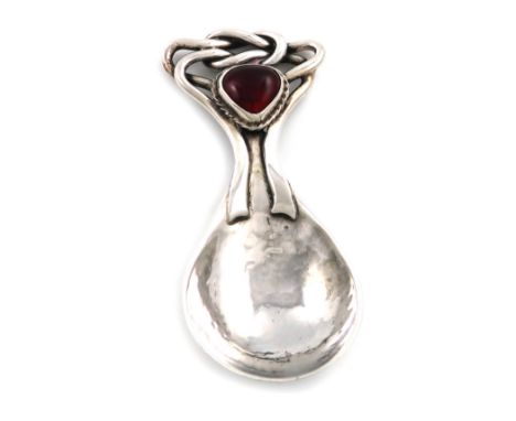 By Omar Ramsden, an Arts and Crafts silver caddy spoon, London 1919, spot-hammered fig-shaped bowl, the terminal with intertw