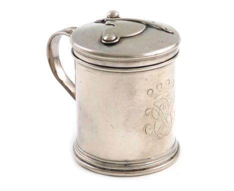 A rare William III silver bougie box, by Daniel Garnier, London 1697, cylindrical form, reeded scroll handle, the hinged cove