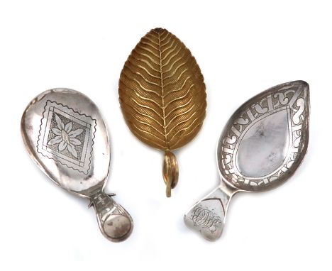 A small collection of three antique silver caddy spoons, comprising: a silver-gilt one of leaf form, textured vein decoration