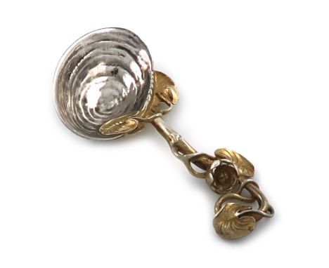 A Victorian parcel-gilt cast silver caddy spoon, by Francis Higgins, London 1852, shell bowl, with a lily pad handle with gil