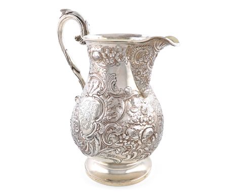 A George IV silver beer jug, by William Eley II, London 1824, baluster form, embossed with  a stag and deer in a forest setti