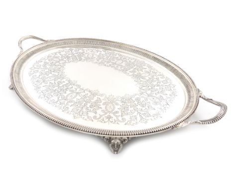 A Victorian silver two-handled tray, by Charles Boyton, London 1886, oval form, beaded and fluted border and scroll handles, 