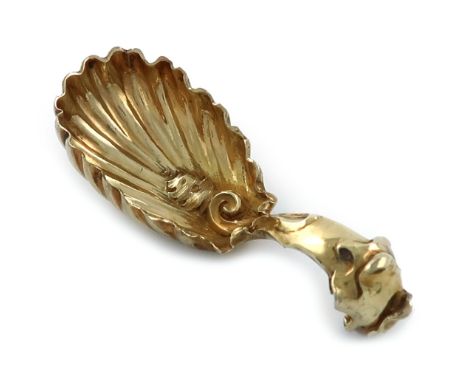 A Victorian cast silver-gilt caddy spoon, by Charles and George Fox, London 1843, fluted oval bowl, wavy-edge border, heavy s