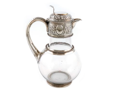 A Victorian silver-mounted glass claret jug, by Aldewinckle and Slater, London 1883, plain glass baluster body, the mounts wi