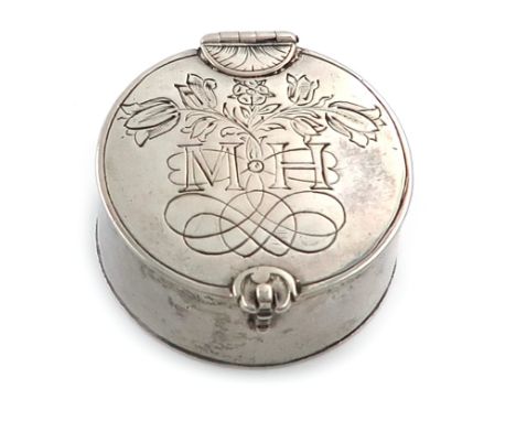 A 17th century silver box, unmarked, circular form, the cover engraved with tulips and a rose, and with later initials 'M.H',