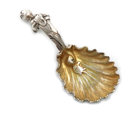 A Victorian cast silver caddy spoon, by Charles and George Fox, London 1860, shell bowl, the interior gilded, the  heavy scro
