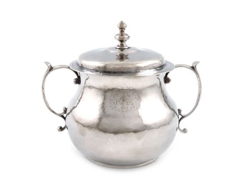 A Charles II silver two-handled porringer and cover, maker's mark probably that of Edward Gladwin, London 1668, plain circula