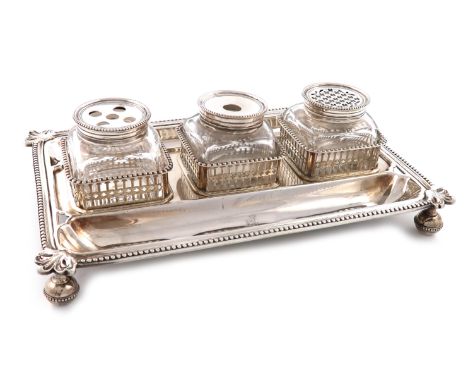 A George III silver inkstand, by Aldridge and Green, London 1774, rectangular form, foliate and beaded borders, with two pen 
