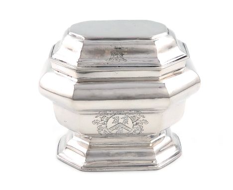 A George I silver sugar box, by Matthew Cooper, overstriking other marks, London 1717, octagonal bombé form, the hinged cover