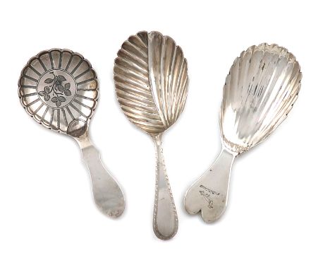 A small collection of three antique Irish and Scottish silver caddy spoons, comprising: one by Samuel Neville, Dublin 1814, f