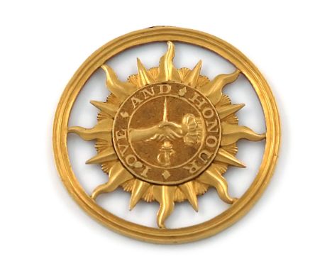 An early 19th century gold commemorative Henry of Monmouth badge, circa 1800, circular form, pierced with a sun motif and wit
