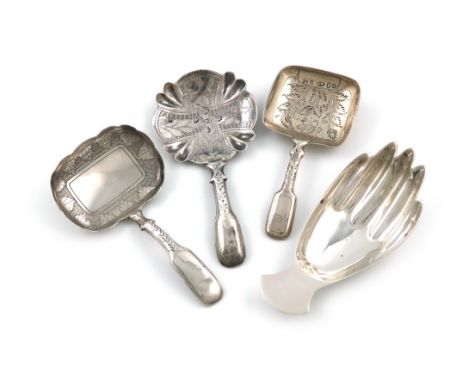 A small collection of four silver caddy spoons, comprising: one modelled as a hand, by F. Howden, Sheffield 1971, plus a Geor