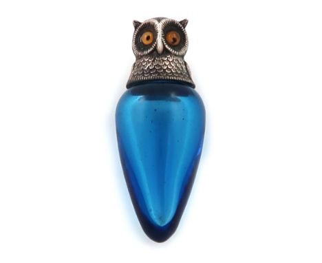 A Victorian novelty silver-mounted owl scent bottle, by S. Mordan and Co, London 1894, tapering blue glass body, the screw-of