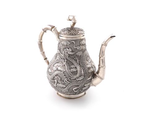 λA Chinese export silver coffee pot, by Ju Long, retailed by Tuck Chang, circa 1900, baluster form, chased with dragons and f