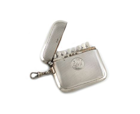 A silver butt marker, by Deakin and Francis, Birmingham 1913, rounded rectangular form, engine-turned decoration, with a ring