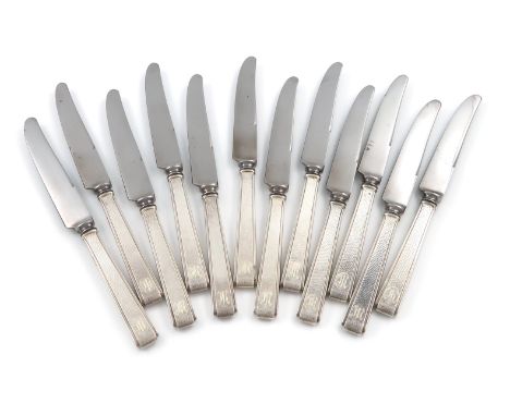 A set of twelve Japanese silver-handled dessert knives, the handles of tapering rectangular form, spot-hammered decoration, i