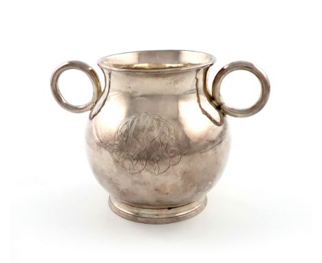 A George I silver 'College' or 'Ox-eye' cup, by George Gillingham, London 1720, baluster form, with tubular ring handles, the
