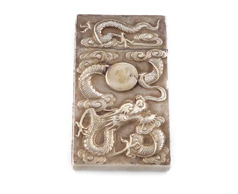 A Chinese silver visiting card case, rectangular form, pull-off cover, the front embossed with a dragon, with a vacant cartou