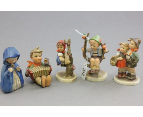 Five Goebel Hummel Figures including Girl kneeling in Blue Cloak