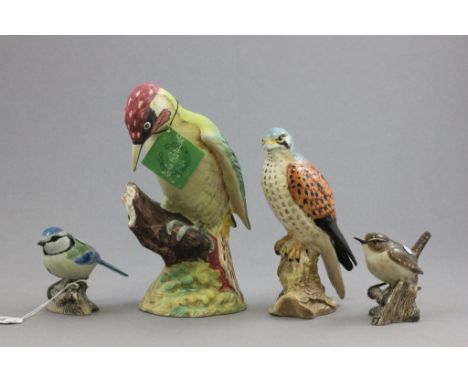 Beswick Green Woodpecker, matt finish, model no. 1218B, Beswick Kestral model no. 2316 and a Ceramic Wren and Blue Tit