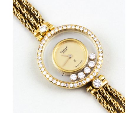 Damenschmuckbanduhr "Chopard Happy Diamonds". 750/000 GG, brutto 26,6 g. Lunette und beidseitig verglastes, rundes Gehäuse be