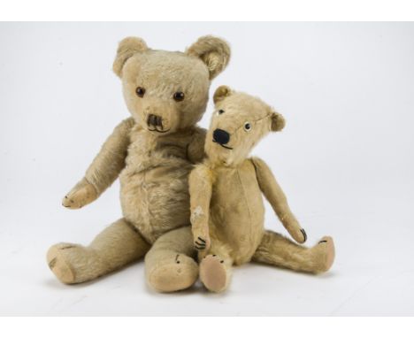 1940s Merrythought teddy bears, with golden mohair, orange and black glass eyes, black stitched nose, mouth and claws, swivel