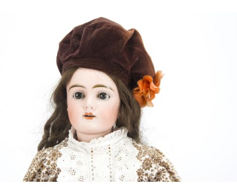 A Heinrick Handwerck 350 child doll, with blue lashed sleeping eyes, pierced ears, brown hair wig, jointed composition body, 