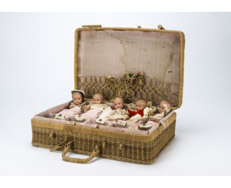 The Dionne Quints, five small composition dolls with painted blue side glancing eyes, Yvonne, Annette, Marie, Cecile and Emil