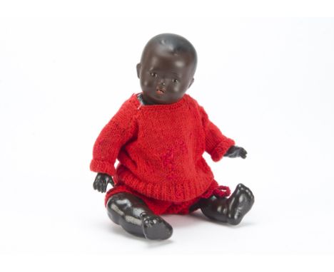 A Heinrich Handwerck painted bisque black baby, with brown sleeping eyes, bent-limed composition body and red knitted clothes