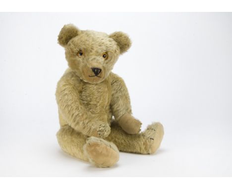 A fine Chad Valley moon eyed teddy bear, 1930s, with blonde mohair, clear and black glass eyes with orange back, pronounced c