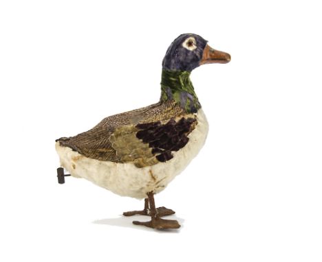 A rare clockwork duck automaton, circa 1910, possibly French with papier-mâché bill, orange and black glass eyes, carton body