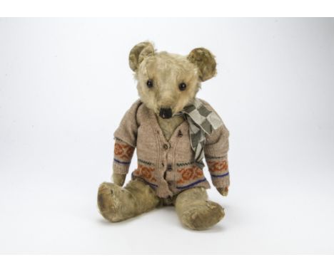 Jasper, a Merrythought 1930s teddy bear, with light golden mohair, orange and black glass eyes, black stitched nose, mouth an