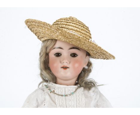 A Max Handwerck 283 child doll, with brown sleeping eyes, blonde mohair wig, jointed composition body, white cotton dress, st