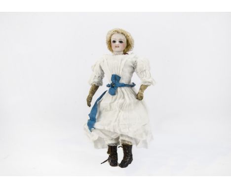 A French pressed bisque fashionable doll, probably Francois Gaultier, the socket shoulder head with deep blue striated glass 