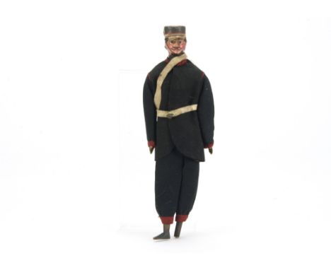 An unusual German 19th century composition shoulder head doll in uniform, possibly a policeman with black painted moulded hai