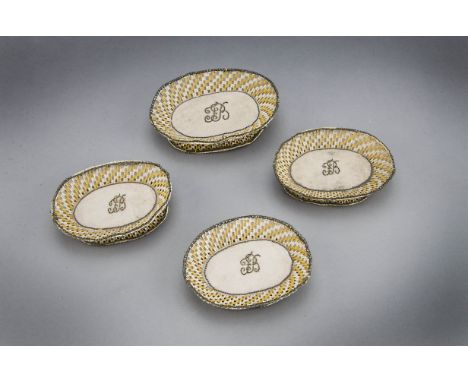 Four oval dressing table trinket dishes, mid 18th century, covered with pink ribbed silk similar to the previous lot, the rim