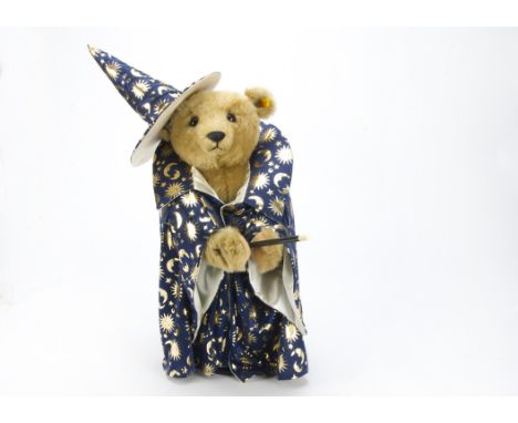A yellow tagged Steiff Teddy Bear dressed as a wizard, made for an exhibition, not by Steiff, in blue conical hat and robe wi