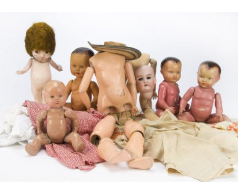 An Armand Marseille Floradora child doll, with blue sleeping eyes and jointed composition body - 17¾in. (45cm.) high (head de
