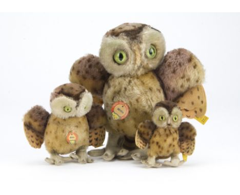 Three Steiff Wittie owls 1950s, the largest - 9in. (23cm.) high (missing beak) and two smaller with felt beaks, the two large