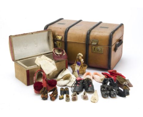 Two doll’s trunks, a brown oil-cloth trunk with black painted bent-wood banding - 13in. (33cm.) wide (one clasp not working);
