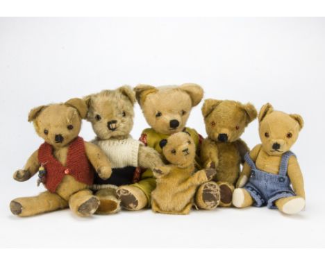 Five post-war British teddy bears: all jointed including a Chad Valley and a Merrythought with label; and a Sooty glove puppe