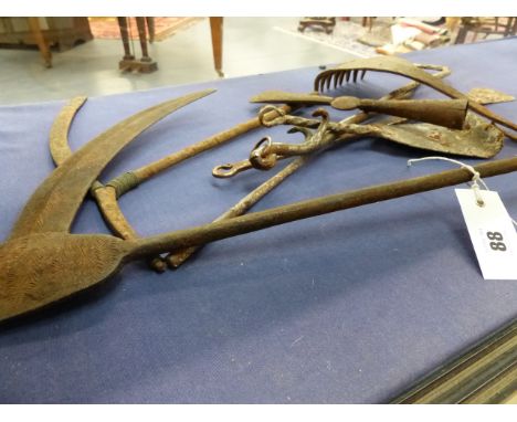 AN AFRICAN IRON CURRENCY SICKLE WITH GEOMETRIC ENGRAVED DECORATION TOGETHER WITH VARIOUS FURTHER IRON CURRENCY TOOLS AND ARTI