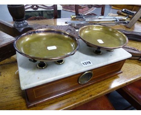 A SET OF SCALES WITH MAHOGANY INLAID BODY, MARBLE SURFACE AND TWO BRASS PANS.