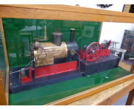 A LARGE SCRATCH BUILT STEAM BOILER AND MILL ENGINE IN A GLAZED DISPLAY CASE.