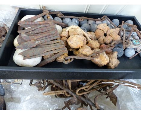 A COLLECTION OF WEST AFRICAN IRON CURRENCY TO INCLUDE A GONG, TOOLS,  SNAKES AND OTHER ANIMALIA, TWO IRON BRACELETS, ETC.  YO