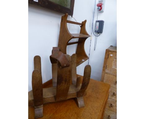 AN ERCOL WALL SHELF AND A MID CENTURY HARDWOOD NEWSPAPER STAND.